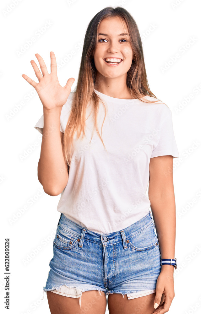 Beautiful caucasian woman wearing casual white tshirt showing and pointing up with fingers number five while smiling confident and happy. Beautiful caucasian woman wearing casual white tshirt showing and pointing up with fingers number five while smiling confident and happy.