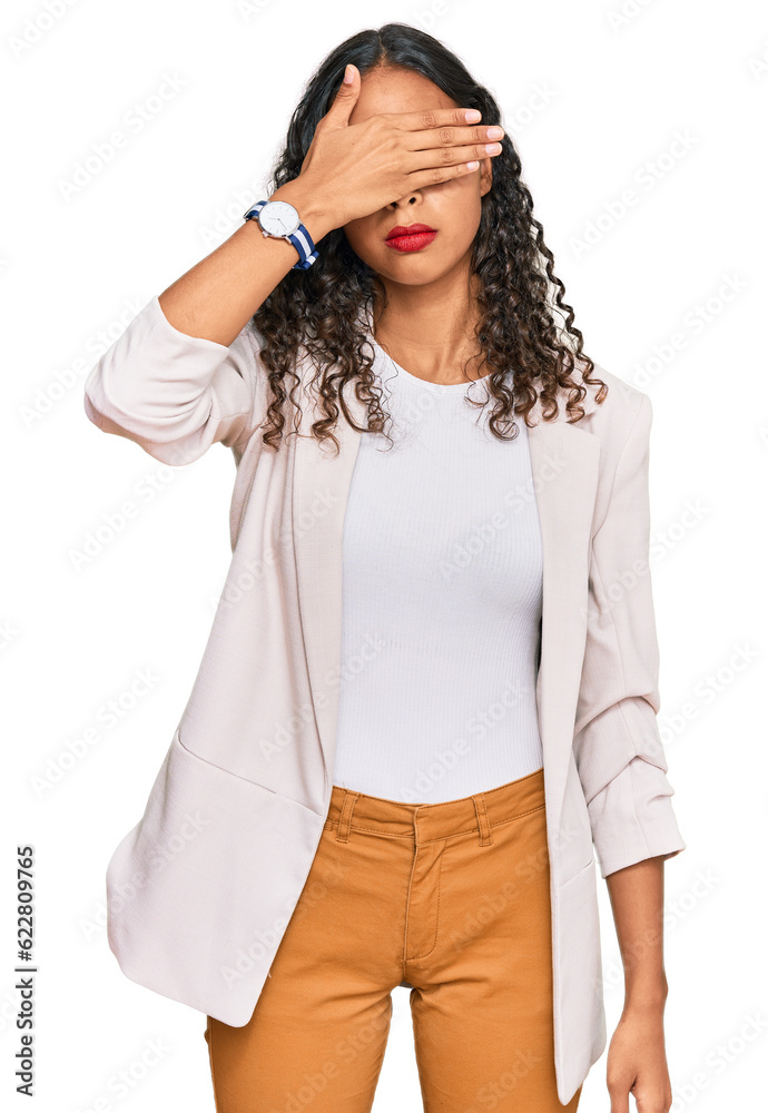 Young african american girl wearing business clothes covering eyes with hand, looking serious and sad. sightless, hiding and rejection concept Young african american girl wearing business clothes covering eyes with hand, looking serious and sad. sightless, hiding and rejection concept