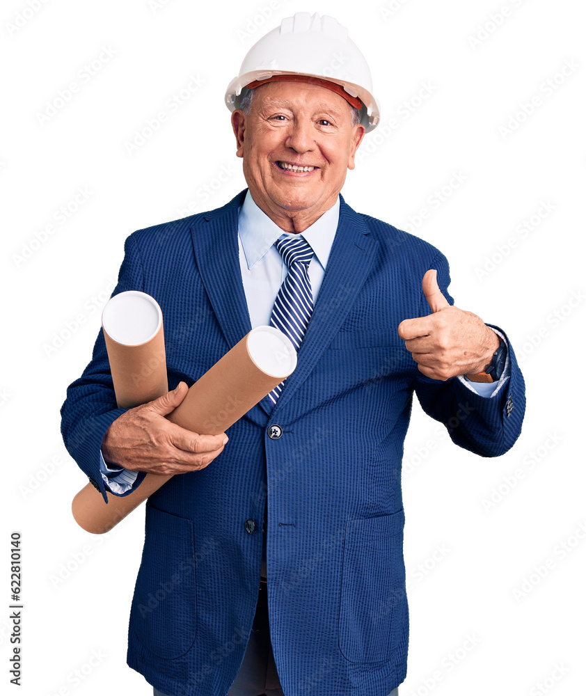 Senior handsome grey-haired man wearing architect hardhat holding blueprints smiling happy and positive, thumb up doing excellent and approval sign Senior handsome grey-haired man wearing architect hardhat holding blueprints smiling happy and positive, thumb up doing excellent and approval sign
