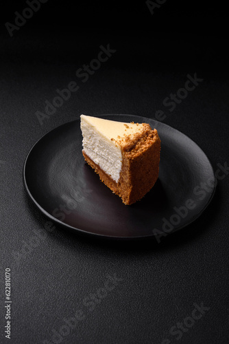 Delicious sweet cheesecake cake on textured concrete background