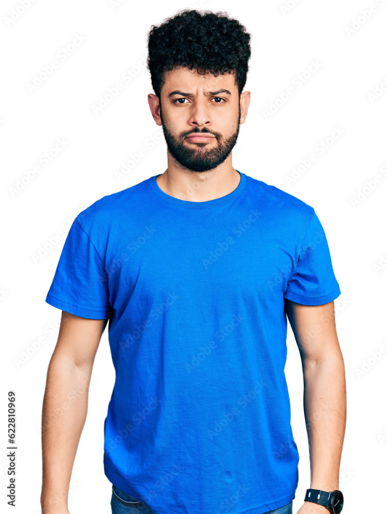 Young arab man with beard wearing casual blue t shirt depressed and worry for distress, crying angry and afraid. sad expression.