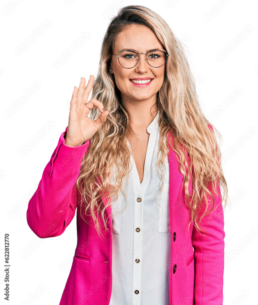 Young blonde woman wearing business style and glasses smiling positive doing ok sign with hand and fingers. successful expression. Young blonde woman wearing business style and glasses smiling positive doing ok sign with hand and fingers. successful expression.