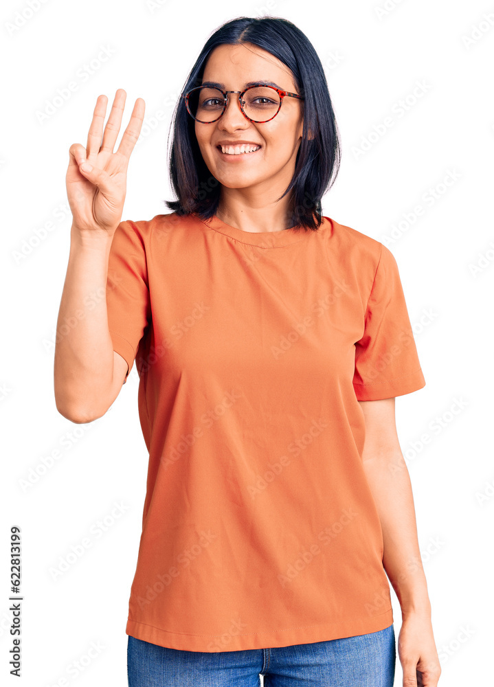 Young beautiful latin woman wearing casual clothes showing and pointing up with fingers number three while smiling confident and happy. Young beautiful latin woman wearing casual clothes showing and pointing up with fingers number three while smiling confident and happy.