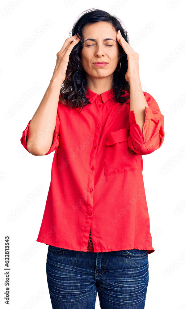 Young beautiful hispanic woman wearing casual clothes with hand on head for pain in head because stress. suffering migraine. Young beautiful hispanic woman wearing casual clothes with hand on head for pain in head because stress. suffering migraine.