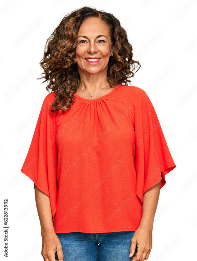 Middle age hispanic woman wearing casual clothes looking positive and happy standing and smiling with a confident smile showing teeth Middle age hispanic woman wearing casual clothes looking positive and happy standing and smiling with a confident smile showing teeth