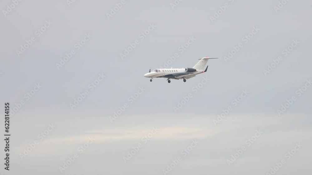 Generic Private VIP Business Executive Jet Flying Above the Clouds and Mountains during Decent