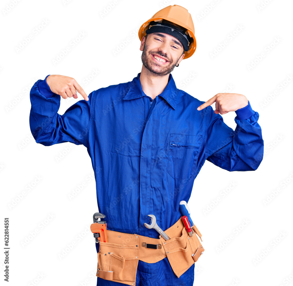 Young hispanic man wearing worker uniform looking confident with smile on face, pointing oneself with fingers proud and happy. Young hispanic man wearing worker uniform looking confident with smile on face, pointing oneself with fingers proud and happy.