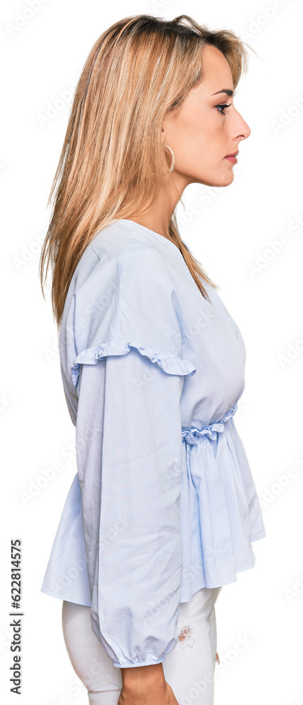 Beautiful blonde business woman wearing casual clothes looking to side, relax profile pose with natural face with confident smile. Beautiful blonde business woman wearing casual clothes looking to side, relax profile pose with natural face with confident smile.