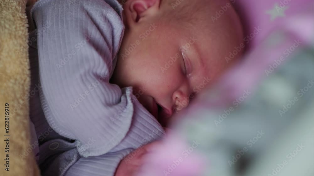Portrait of a charming newborn baby sleeping in a bed Portrait of a charming newborn baby sleeping in a bed