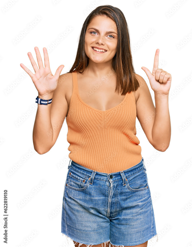 Young caucasian woman wearing casual clothes showing and pointing up with fingers number seven while smiling confident and happy. Young caucasian woman wearing casual clothes showing and pointing up with fingers number seven while smiling confident and happy.
