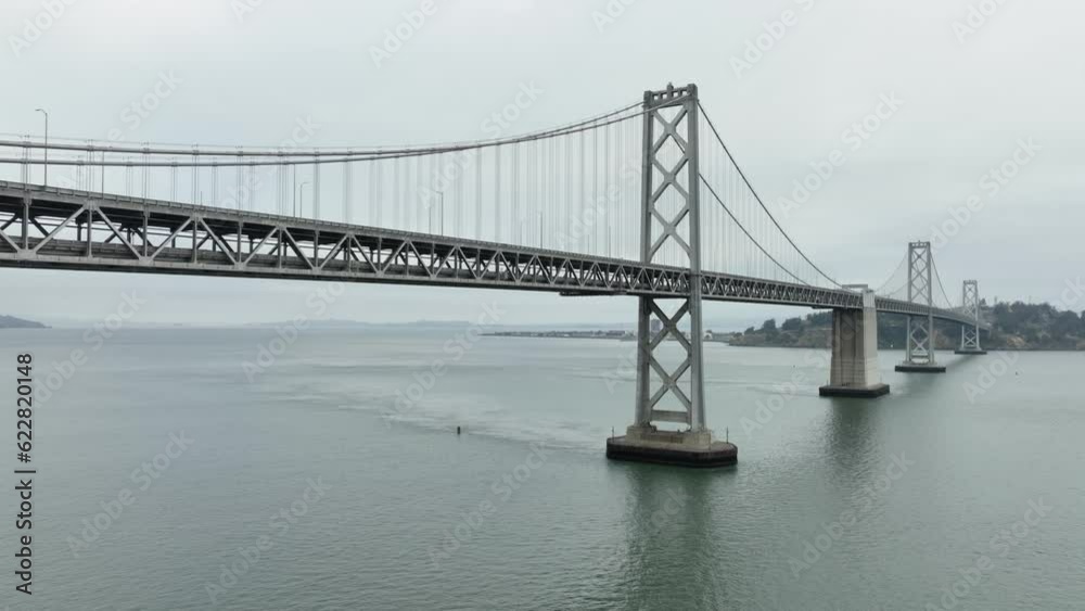 Aerial of the bay bridge and downtown San Francisco Skyline on an overcast and gray morning. Aerial of the bay bridge and downtown San Francisco Skyline on an overcast and gray morning.