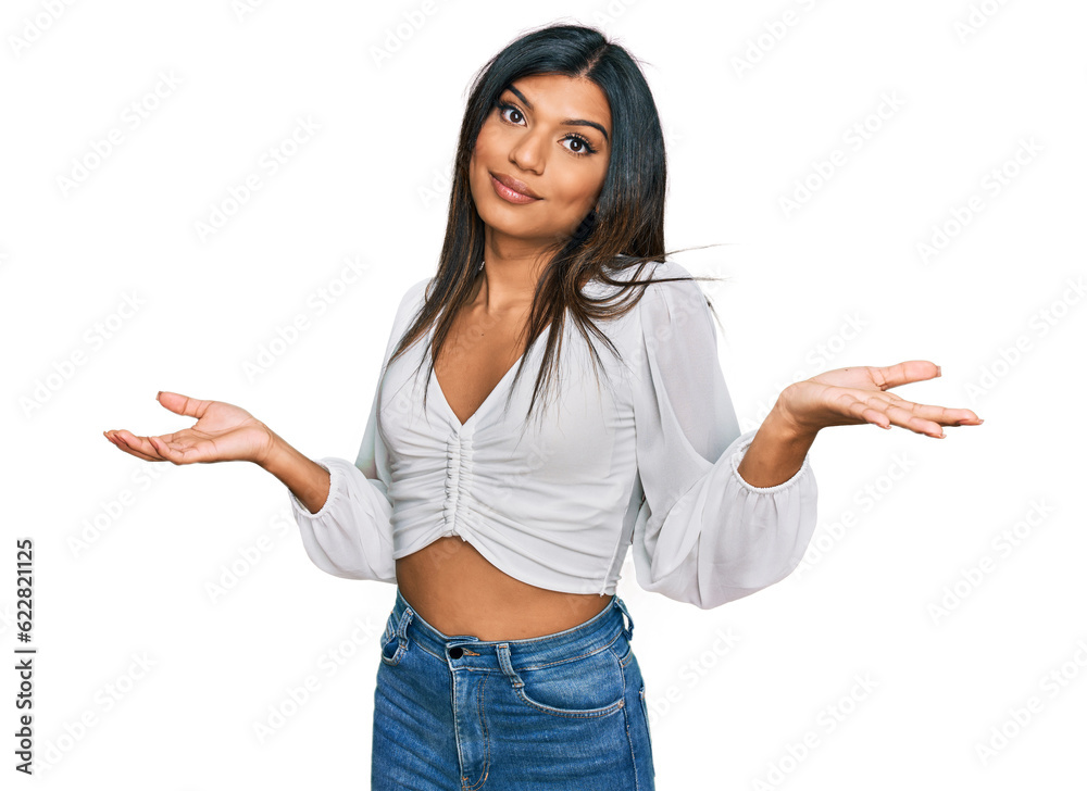 Young latin transsexual transgender woman wearing casual clothes clueless and confused expression with arms and hands raised. doubt concept. Young latin transsexual transgender woman wearing casual clothes clueless and confused expression with arms and hands raised. doubt concept.