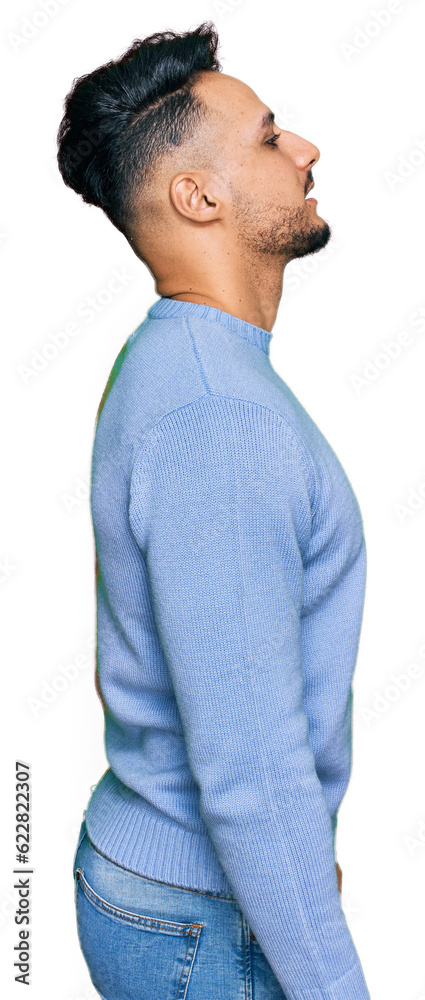 Young arab man wearing casual clothes looking to side, relax profile pose with natural face with confident smile. Young arab man wearing casual clothes looking to side, relax profile pose with natural face with confident smile.