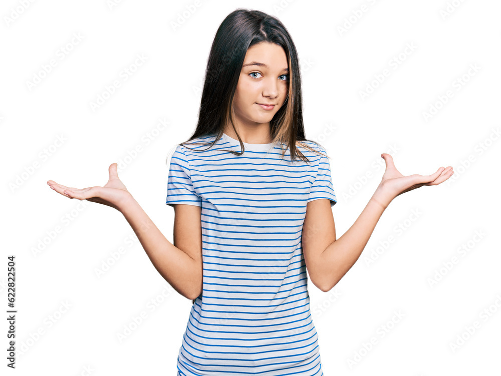 Young brunette girl with long hair wearing casual striped t shirt clueless and confused with open arms, no idea and doubtful face. Young brunette girl with long hair wearing casual striped t shirt clueless and confused with open arms, no idea and doubtful face.