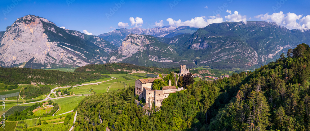 Italy travel destinations. Famous medieval castle Madruzzo in Trentino Alto Adige region province of Trento. Aerial panoramic drone view