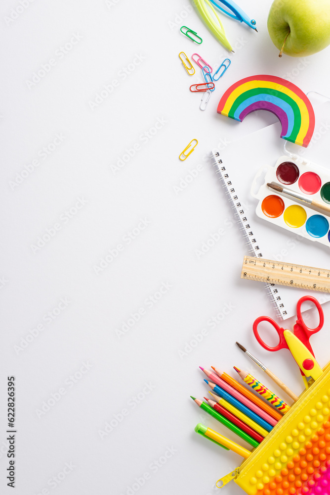 Immerse yourself in the realm of studying art at school with this top view vertical snapshot: an album, watercolor paints and vivid stationery on isolated white background, ready for text or adverts Immerse yourself in the realm of studying art at school with this top view vertical snapshot: an album, watercolor paints and vivid stationery on isolated white background, ready for text or adverts