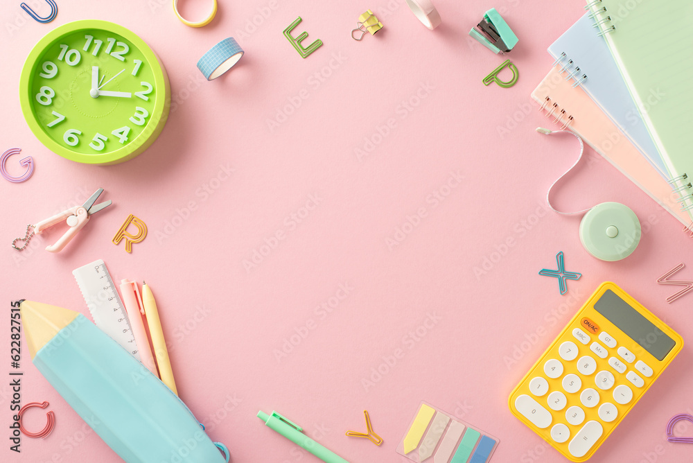 Brighten your study space! Top view of stationery, copybooks, pencil case, calculator, clock, alphabet letters and more on pastel pink background. Take advantage of the blank frame for text or advert Brighten your study space! Top view of stationery, copybooks, pencil case, calculator, clock, alphabet letters and more on pastel pink background. Take advantage of the blank frame for text or advert