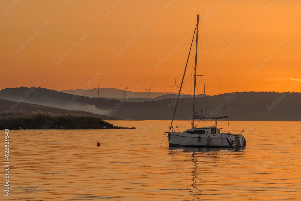 beautiful sunset at the sea with boats