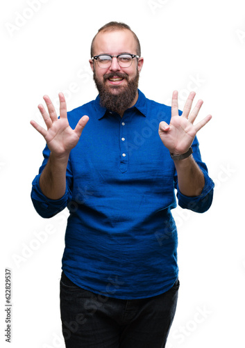 Young caucasian hipster man wearing glasses over isolated background showing and pointing up with fingers number nine while smiling confident and happy.