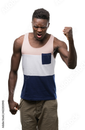Young african american man annoyed and frustrated shouting with anger, crazy and yelling with raised hand, anger concept