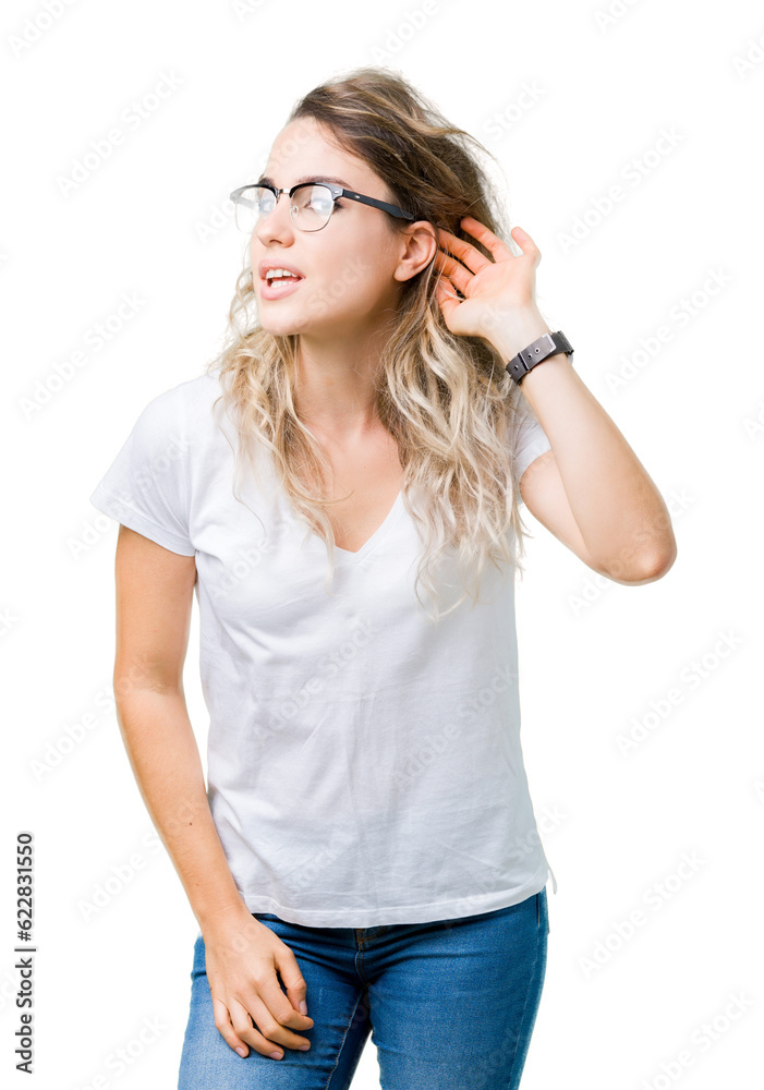 Beautiful young blonde woman wearing glasses over isolated background smiling with hand over ear listening an hearing to rumor or gossip. Deafness concept. Beautiful young blonde woman wearing glasses over isolated background smiling with hand over ear listening an hearing to rumor or gossip. Deafness concept.