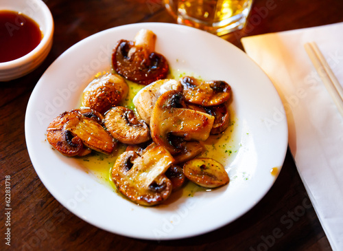 Popular Japanese style grilled sliced mushrooms topped with spicy green sauce