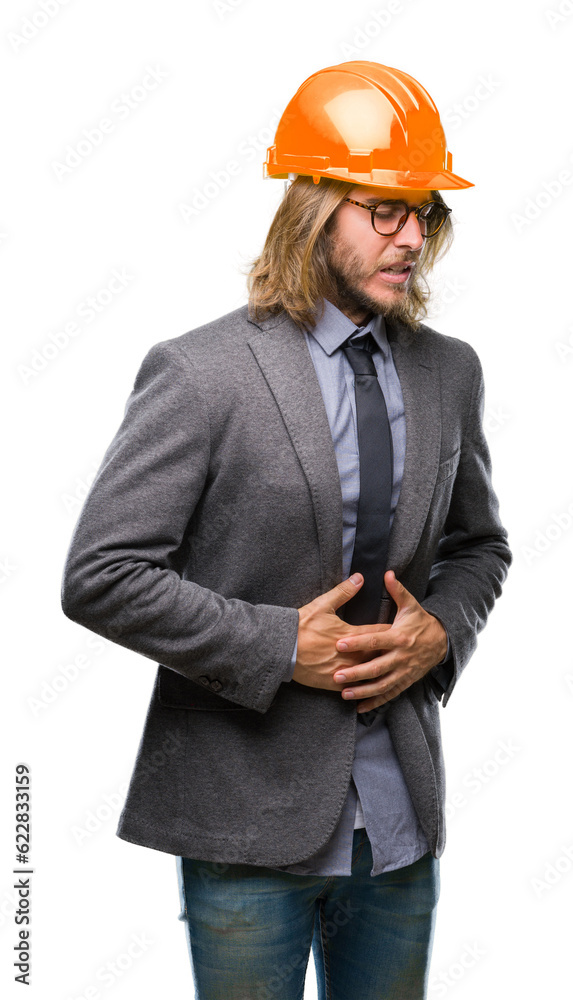 Young handsome architec man with long hair wearing safety helmet over isolated background with hand on stomach because indigestion, painful illness feeling unwell. Ache concept. Young handsome architec man with long hair wearing safety helmet over isolated background with hand on stomach because indigestion, painful illness feeling unwell. Ache concept.