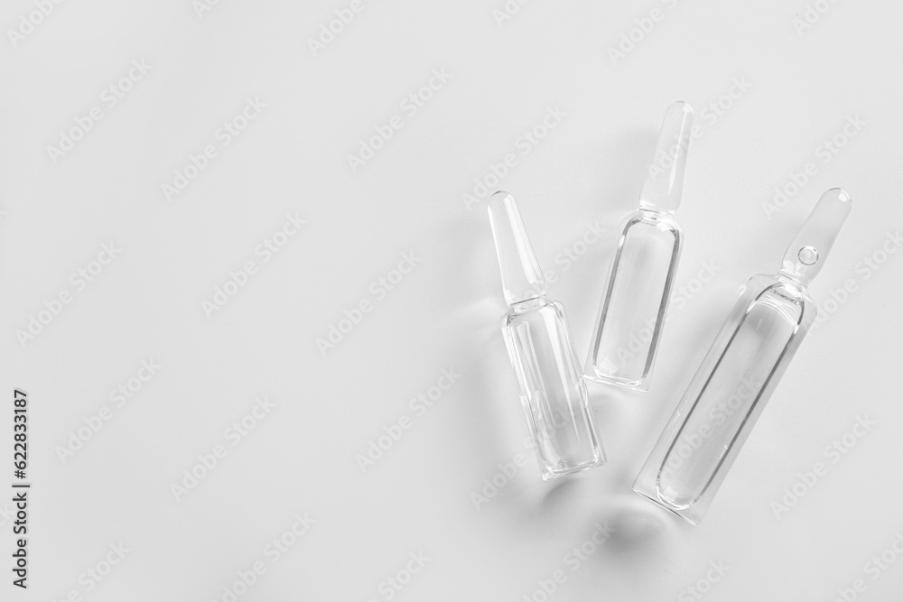 Medical ampules on light background Medical ampules on light background