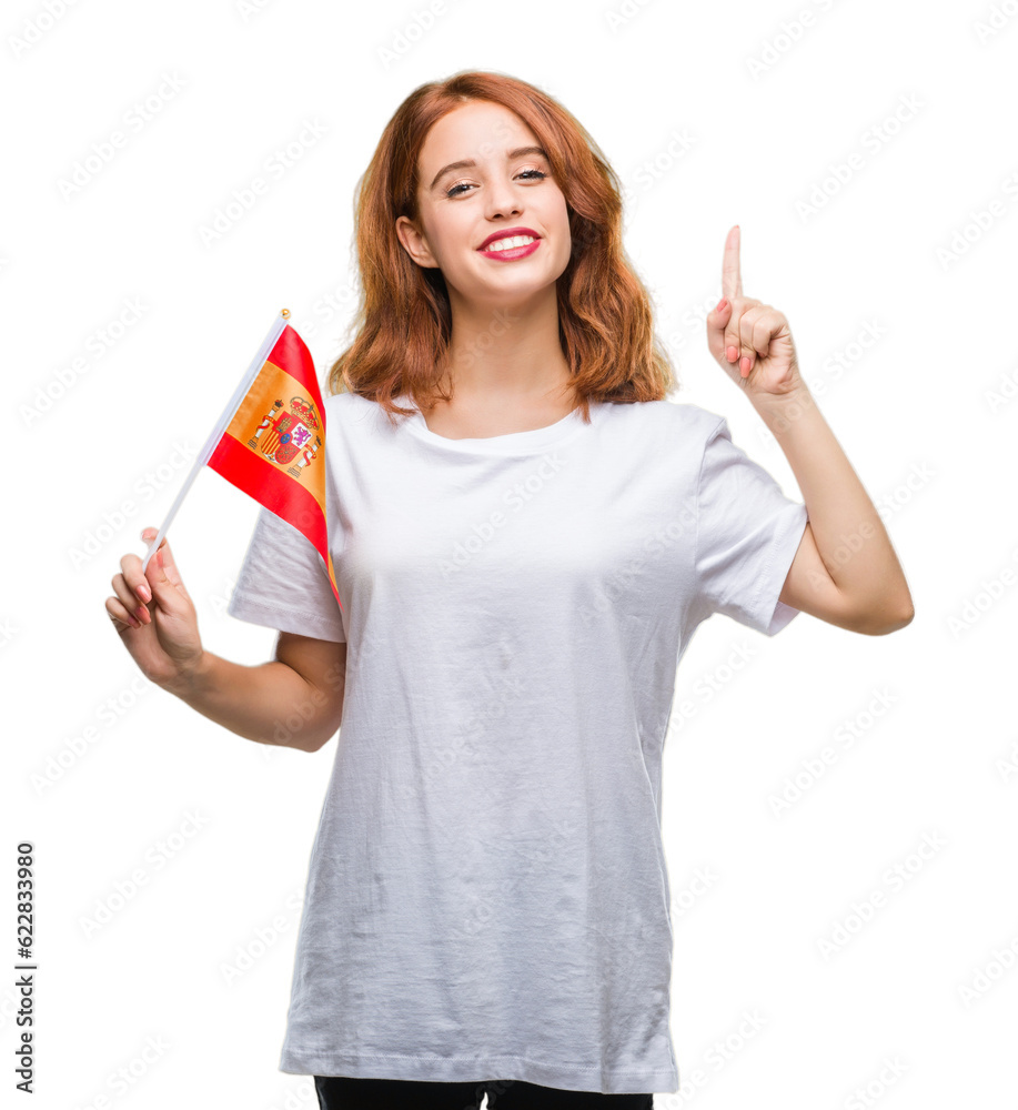 Young beautiful woman holding flag of spain over isolated background surprised with an idea or question pointing finger with happy face, number one Young beautiful woman holding flag of spain over isolated background surprised with an idea or question pointing finger with happy face, number one