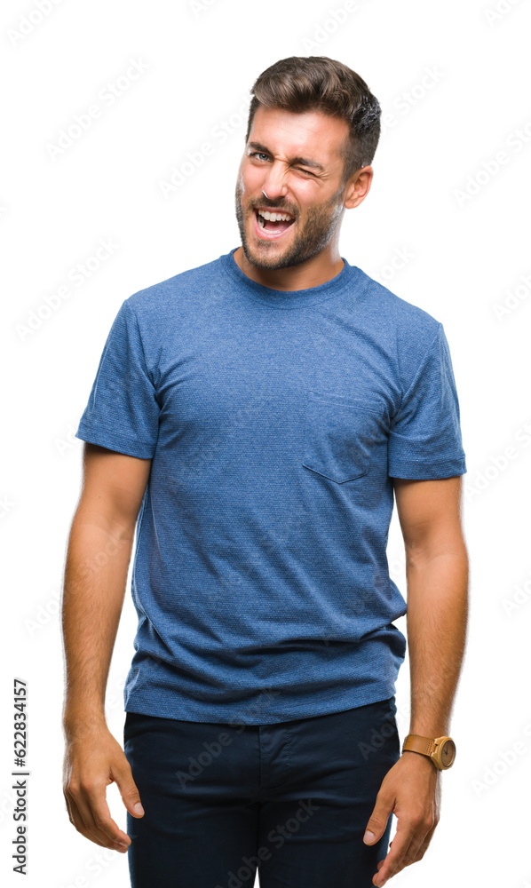 Young handsome man over isolated background winking looking at the camera with sexy expression, cheerful and happy face. Young handsome man over isolated background winking looking at the camera with sexy expression, cheerful and happy face.