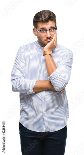 Young handsome man over isolated background thinking looking tired and bored with depression problems with crossed arms.