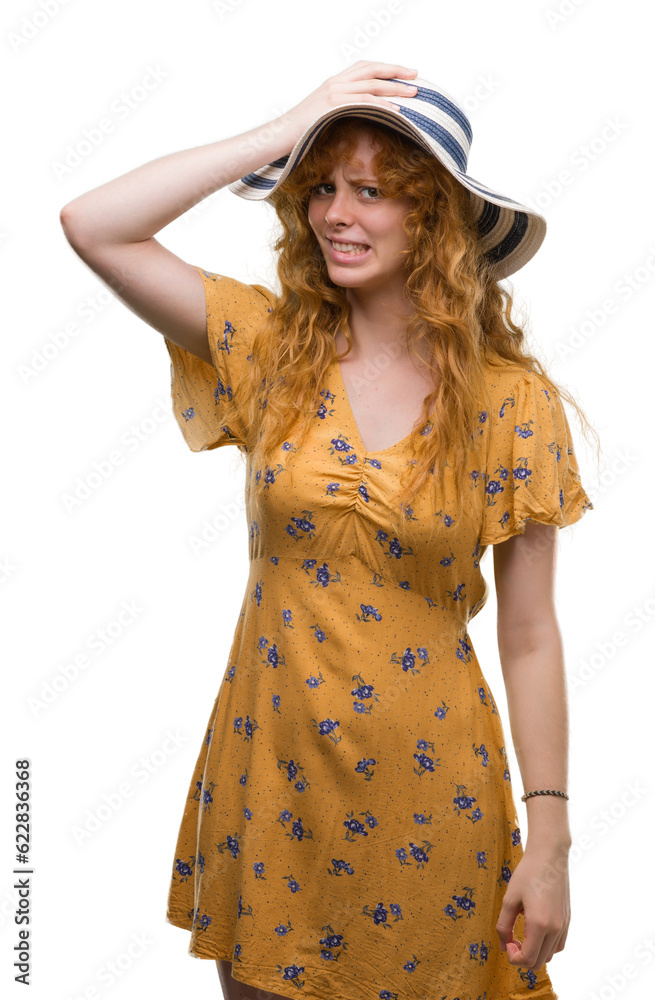 Young redhead woman wearing summer hat and dress stressed with hand on head, shocked with shame and surprise face, angry and frustrated. Fear and upset for mistake. Young redhead woman wearing summer hat and dress stressed with hand on head, shocked with shame and surprise face, angry and frustrated. Fear and upset for mistake.