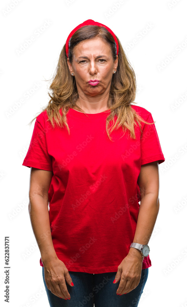 Middle age senior hispanic woman over isolated background skeptic and nervous, frowning upset because of problem. Negative person. Middle age senior hispanic woman over isolated background skeptic and nervous, frowning upset because of problem. Negative person.
