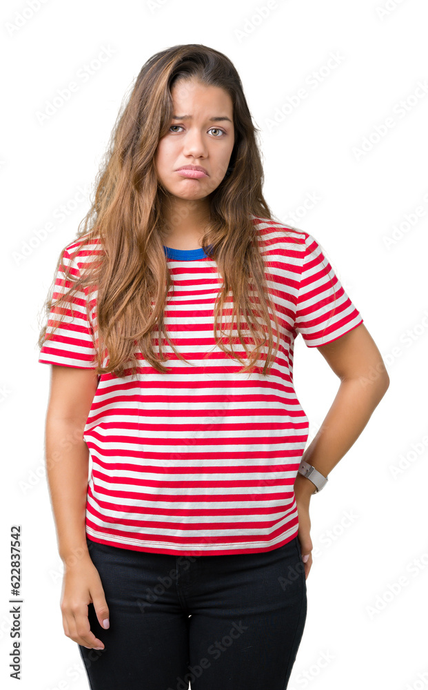 Young beautiful brunette woman wearing stripes t-shirt over isolated background depressed and worry for distress, crying angry and afraid. Sad expression. Young beautiful brunette woman wearing stripes t-shirt over isolated background depressed and worry for distress, crying angry and afraid. Sad expression.