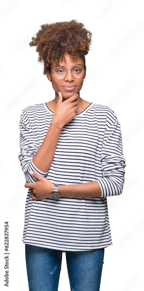 Beautiful young african american woman wearing glasses over isolated background looking confident at the camera with smile with crossed arms and hand raised on chin. Thinking positive. Beautiful young african american woman wearing glasses over isolated background looking confident at the camera with smile with crossed arms and hand raised on chin. Thinking positive.