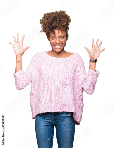 Beautiful young african american woman wearing glasses over isolated background showing and pointing up with fingers number ten while smiling confident and happy.