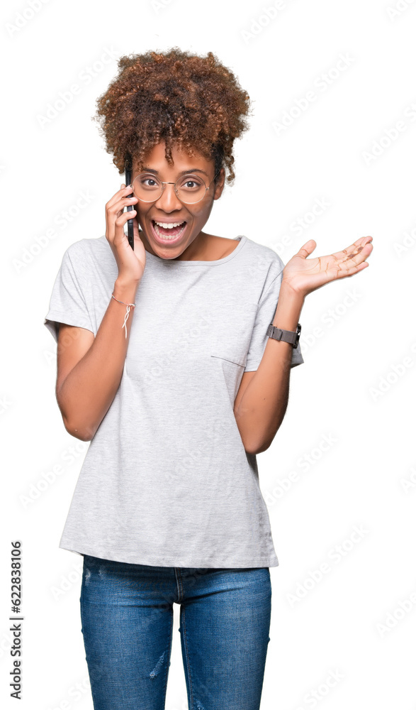 Young african american woman talking on smartphone over isolated background very happy and excited, winner expression celebrating victory screaming with big smile and raised hands Young african american woman talking on smartphone over isolated background very happy and excited, winner expression celebrating victory screaming with big smile and raised hands