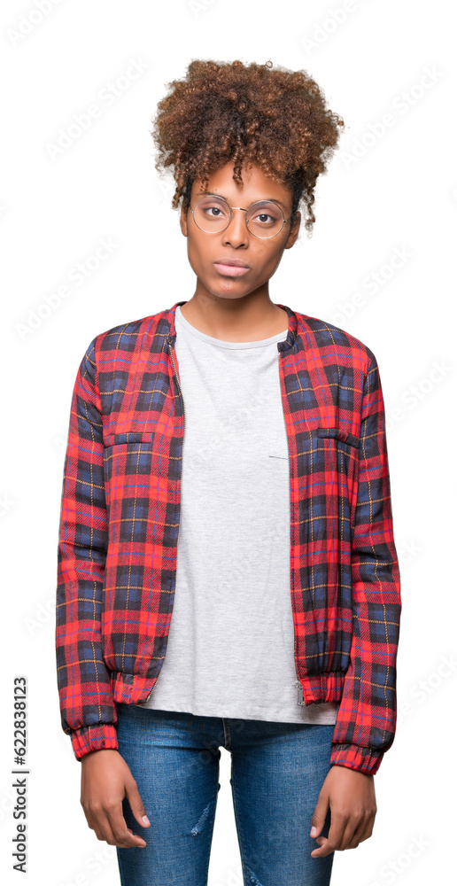 Beautiful young african american woman wearing glasses over isolated background Relaxed with serious expression on face. Simple and natural looking at the camera.