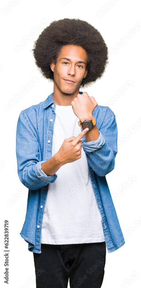 Young african american man with afro hair In hurry pointing to watch time, impatience, upset and angry for deadline delay Young african american man with afro hair In hurry pointing to watch time, impatience, upset and angry for deadline delay