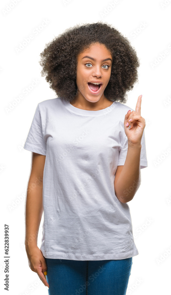 Young afro american woman over isolated background pointing finger up with successful idea. Exited and happy. Number one.