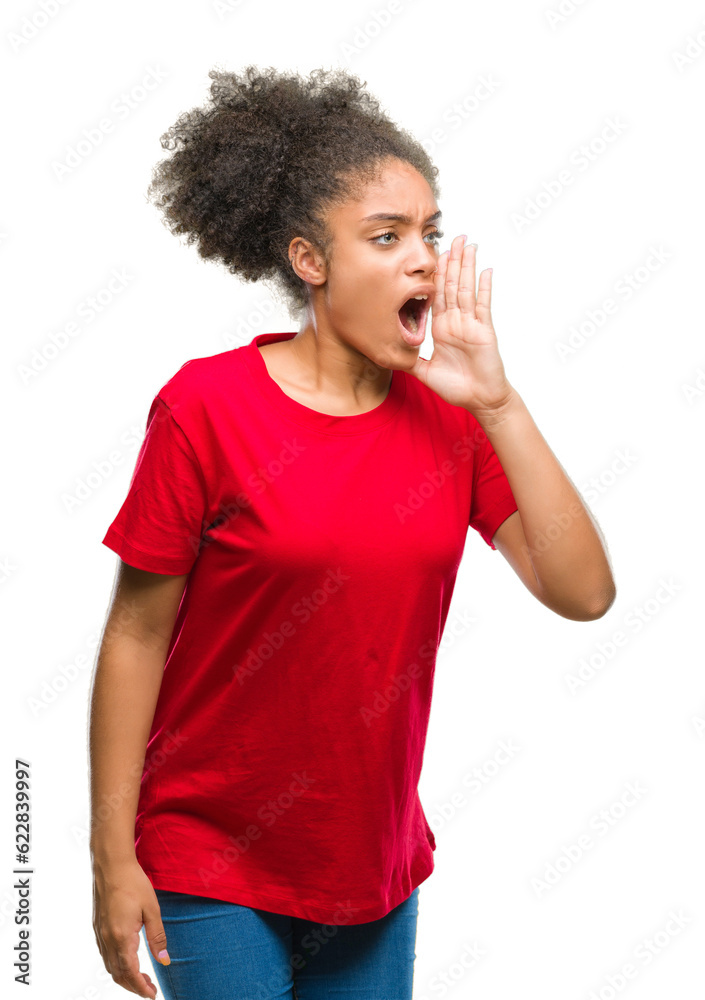 Young afro american woman over isolated background shouting and screaming loud to side with hand on mouth. Communication concept. Young afro american woman over isolated background shouting and screaming loud to side with hand on mouth. Communication concept.
