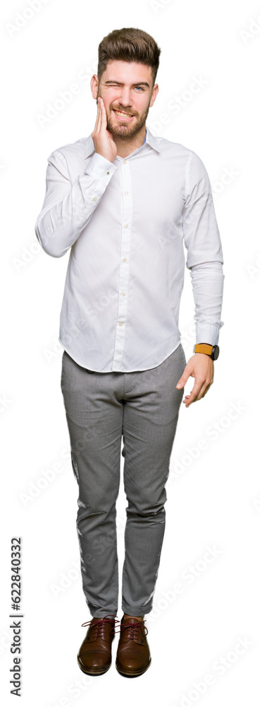 Young handsome business man touching mouth with hand with painful expression because of toothache or dental illness on teeth. Dentist concept. Young handsome business man touching mouth with hand with painful expression because of toothache or dental illness on teeth. Dentist concept.