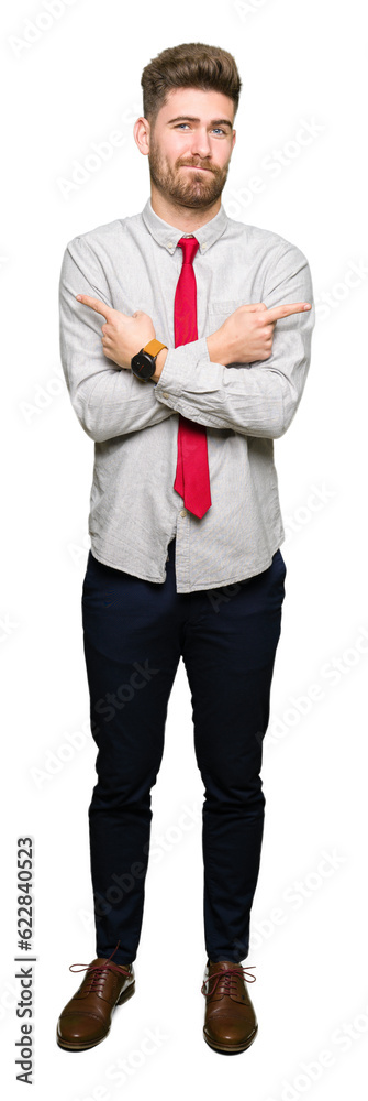 Young handsome business man Pointing to both sides with fingers, different direction disagree Young handsome business man Pointing to both sides with fingers, different direction disagree