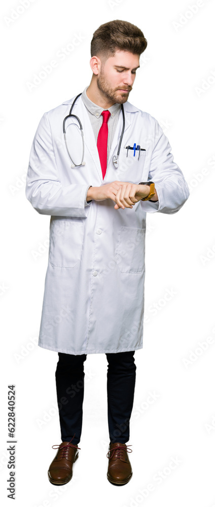 Young handsome doctor man wearing medical coat Checking the time on wrist watch, relaxed and confident Young handsome doctor man wearing medical coat Checking the time on wrist watch, relaxed and confident