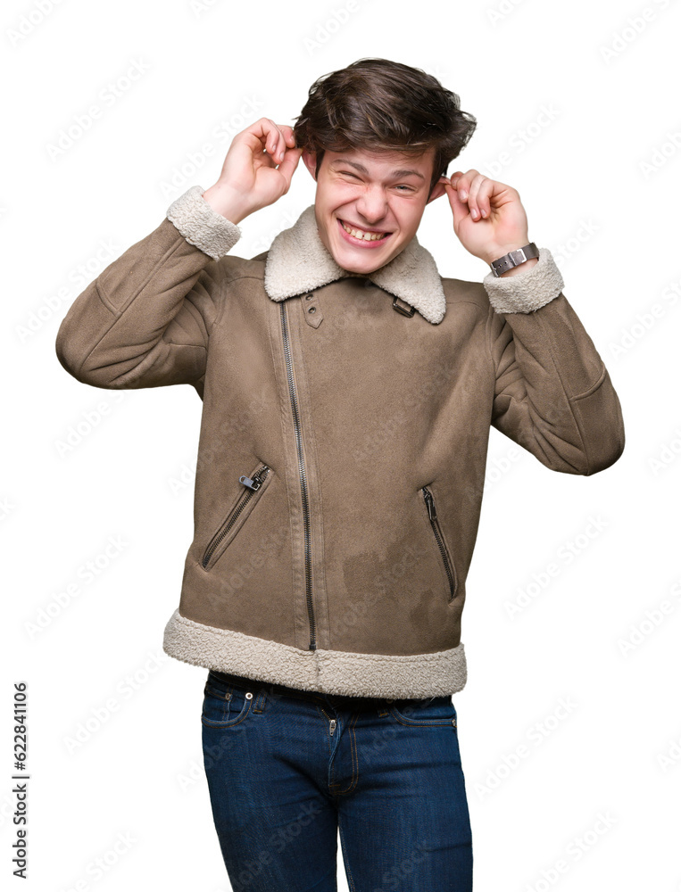 Young handsome man wearing winter coat over isolated background covering ears with fingers with annoyed expression for the noise of loud music. Deaf concept. Young handsome man wearing winter coat over isolated background covering ears with fingers with annoyed expression for the noise of loud music. Deaf concept.