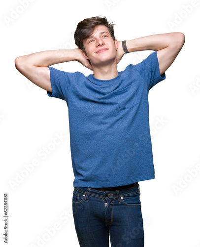 Young handsome man wearing blue t-shirt over isolated background Relaxing and stretching with arms and hands behind head and neck, smiling happy © Krakenimages.com