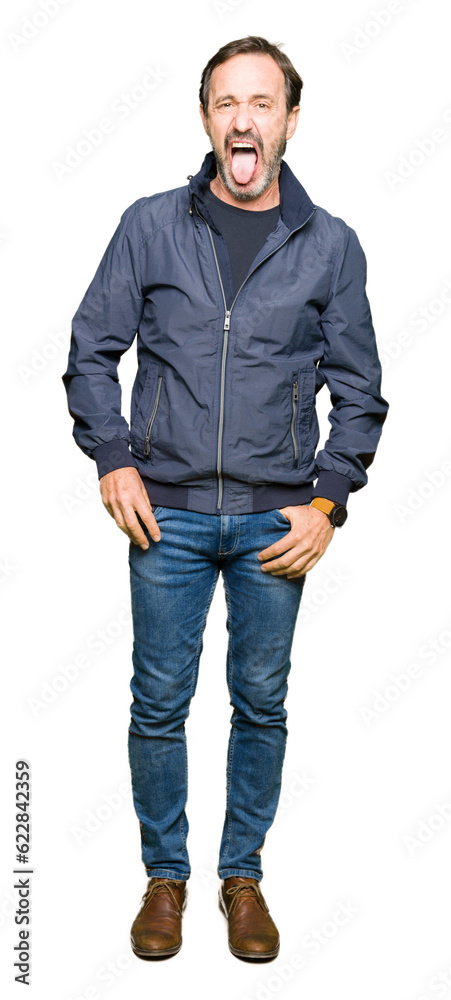 Middle age handsome man wearing a jacket sticking tongue out happy with funny expression. Emotion concept. Middle age handsome man wearing a jacket sticking tongue out happy with funny expression. Emotion concept.