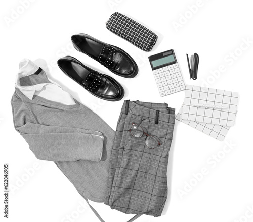 Composition with stylish school uniform, shoes and stationery on white background