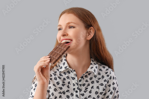 Young woman eating tasty ch...