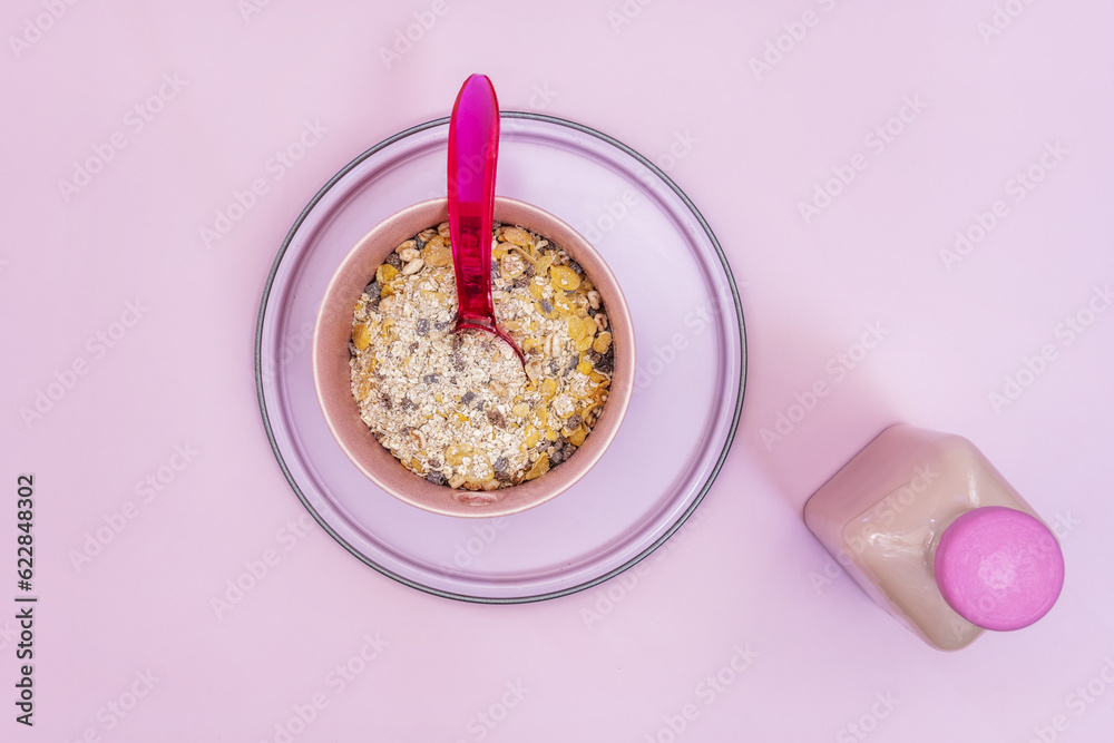 A still life of cereals in a pink bowl A still life of cereals in a pink bowl